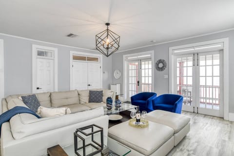 Kick up your feet and relax in this modern living room, where there is a comfortable seat for your entire group.
