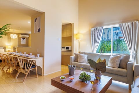 Executive Villa | Living area | 65-inch flat-screen TV with cable channels