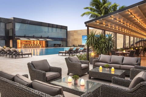 Indoor pool, outdoor pool, open 10:00 AM to 6:00 PM, pool umbrellas