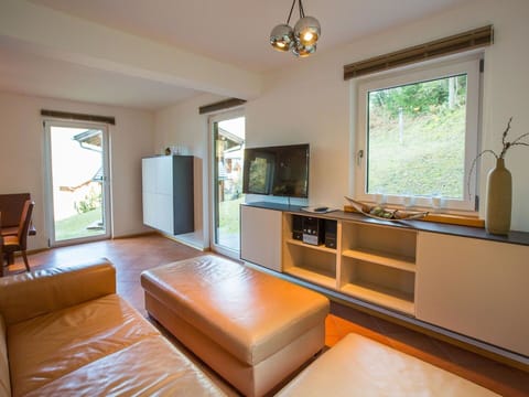 Interior Design, Furniture, Flooring, Wood, Floor, Television, Room, Ceiling, Lighting, Living Room