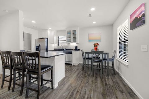 Nearby sits our four-top dining table and additional bar seating.