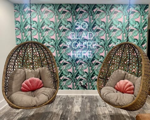 Unwind in style with relaxing hanging egg chairs, perfect for lounging and enjoying company. These cozy seats offer a serene spot to relax, while also providing the ideal photo op for capturing your stay.