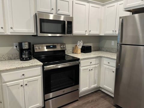 Brand new stainless appliances, granite countertops, and kitchen necessities.