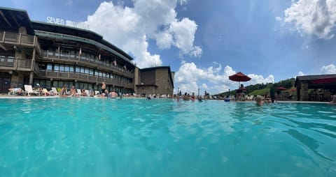 Inviting poolside experience with panoramic views and open skies, ideal for unwinding and enjoying the fresh mountain air.