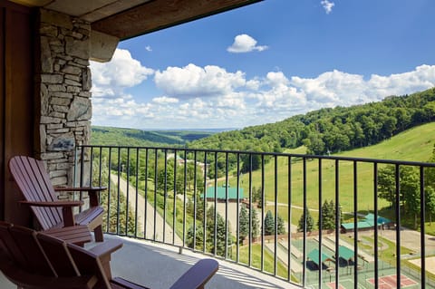 Private balcony with stunning views of rolling hills, perfect for soaking in the tranquil surroundings.