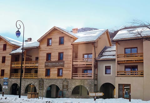 The charming architecture of Les Balcons du Viso, blending harmoniously with the picturesque alpine surroundings.