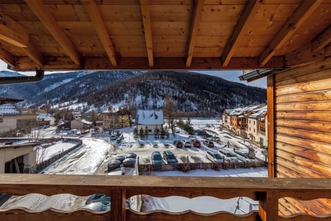 A stunning balcony view overlooking the snow-covered landscape, offering breathtaking mountain scenery.