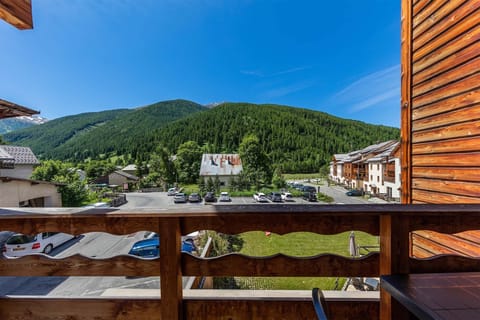 A breathtaking balcony view of the lush green mountains, offering a serene and refreshing summer escape.