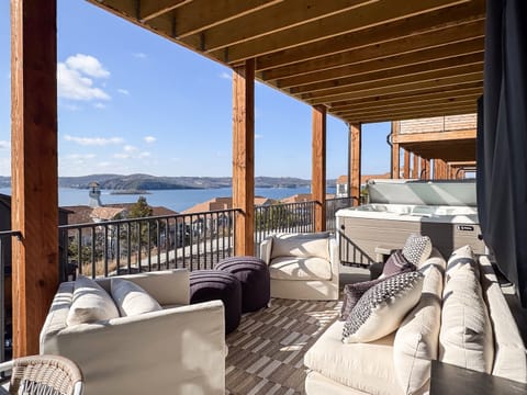 Seating and hot tub on deck to lounge and relax