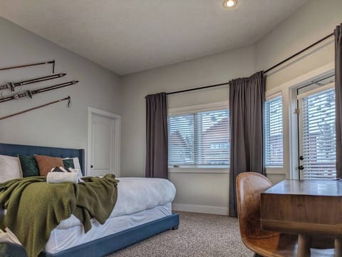Primary bedroom with sauna, en-suite bathroom, jetted tub, workspace and balcony. 