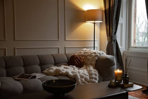 Family Apartment, City View | Living area | 24-inch flat-screen TV with cable channels