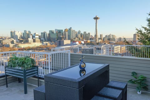 Unobstructed Space Needle and city skyline views from private rooftop.