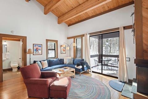 Open living space with Smart TV, and balcony