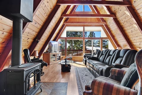 Living room with TV, and fireplace