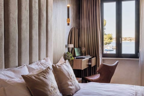 Deluxe Double Room, Sea View | Minibar, in-room safe, desk, laptop workspace