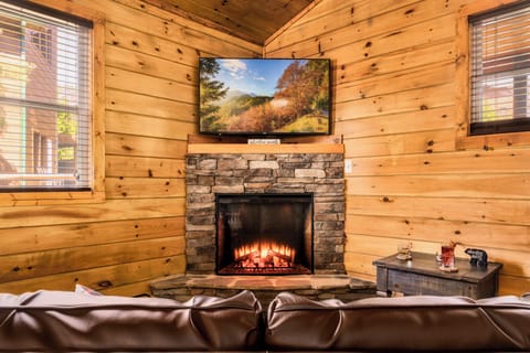 Living room with electric fire place and 55" SmartTV