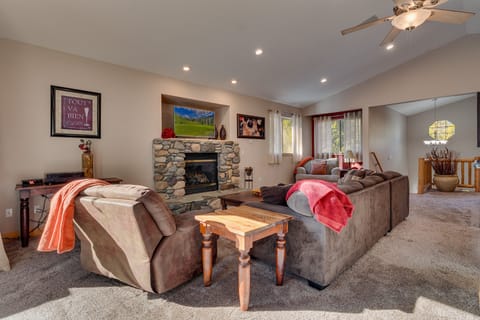 2nd level living area with comfy couch, fireplace, and flat screen TV