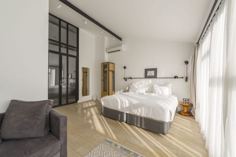 Loft Suite with Kitchen and Terrace | Minibar, in-room safe, desk, laptop workspace