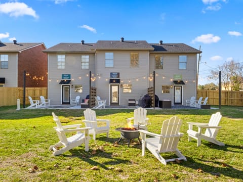 Fully fenced backyard with shared fire pit