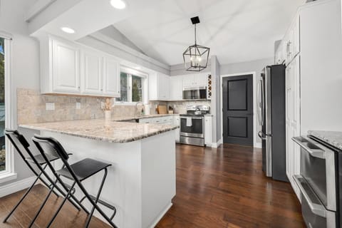 Extra seating at the kitchen counter - perfect for casual bites or keeping the cook company.