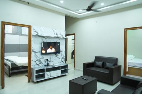 Family Studio, Balcony, City View | Living area | Flat-screen TV