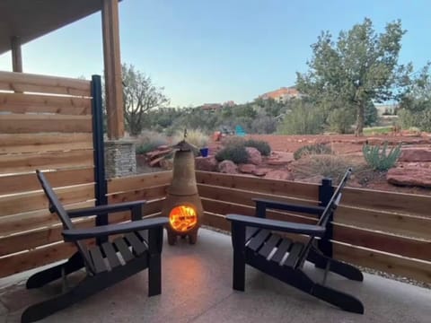Wood Burning Chiminea - Outdoor Patio - Red Canyon Casita - Guests have an outdoor patio with adirondack chairs and Mexican sarapes (outdoor blankets).