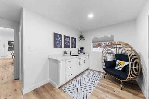 Enjoy a private coffee bar in the master bedroom with sink, countertop, and cozy prep area — perfect for starting your day or unwinding with a morning coffee in your own retreat.