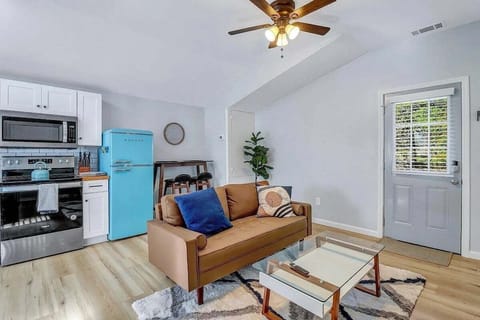 Cozy up in the living room, where natural light meets modern comfort—complete with a smart TV for your favorite shows and movies!
