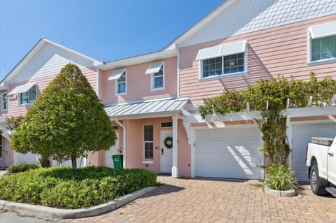 Say hello to Cape Crossing 103, your charming pink townhome just steps from the marina and adventure.