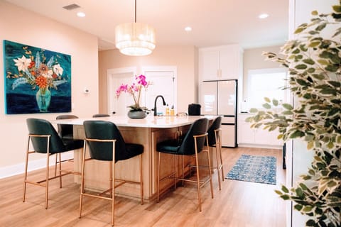 Kitchen is huge with a beautiful island and the latest Samsung Bespoke appliances.