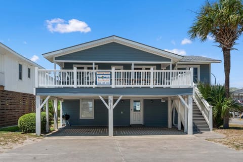 Two-story beach house with an elevated porch at Rising Tide, an 8-bedroom Cherry Grove rental from Thomas Beach Vacations
