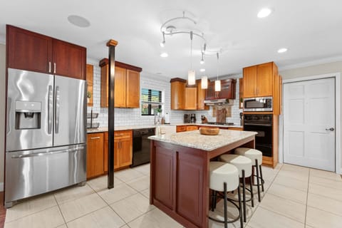 The warm, open kitchen offers ample space & every home comfort