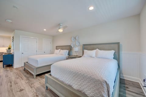 Your spacious bedroom features two comfortable beds with crisp white linens, creating the perfect retreat for restful nights.