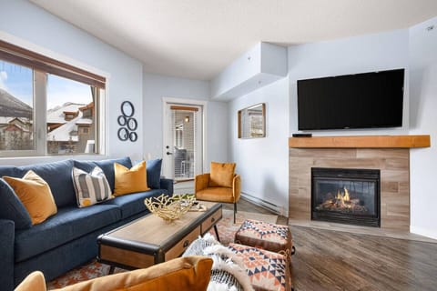 Living room area with fireplace to have a cozy stay.
