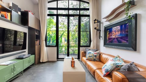 Relax in style on the comfy couch in this cozy living space, where art meets comfort.