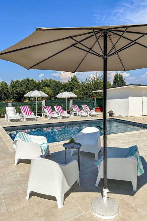 Furniture, Umbrella, Outdoor Furniture, Chair, Swimming Pool, Table, Outdoor Table, Shade, Sunlounger, Resort