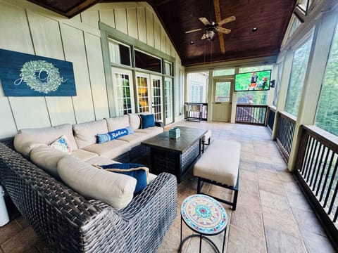 Expansive Screen Porch w/ Sectional Sofa Fire Table, Smart Outdoor TV