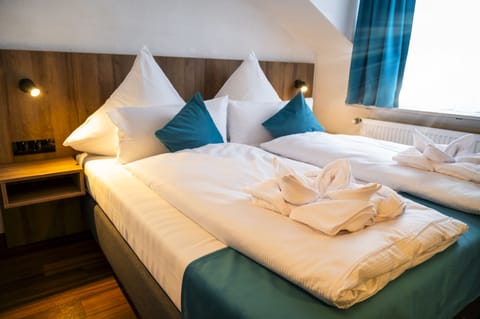 Hypo-allergenic bedding, pillowtop beds, desk, blackout drapes