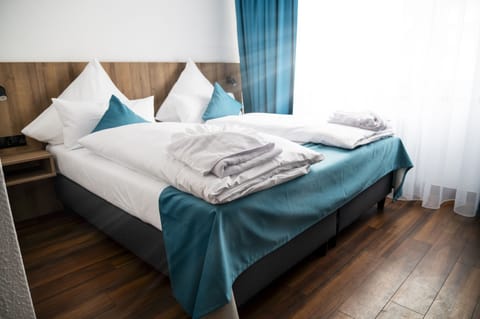 Hypo-allergenic bedding, pillowtop beds, desk, blackout drapes