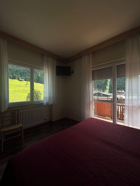Deluxe Triple Room, Balcony, Mountain View | In-room safe, desk, free WiFi, bed sheets