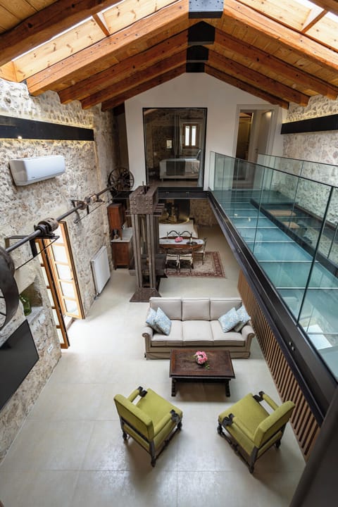 Deluxe Villa, Pool View | Living area | Flat-screen TV, fireplace