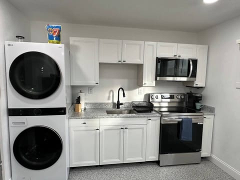 Full kitchen with washer and dryer