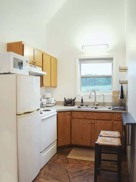 The kitchen is fully equipped with silverware, plates, cups, coffee mugs, dishes, toaster, and coffee maker. Just bring your favorite food and drinks!