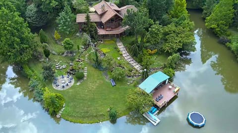 Grace Woods Lake house! complete with a covered lake deck, private fire pit and lake toys for guests to enjoy. 
