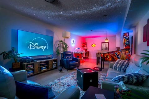 Game room with bunk bed, 6 commercial-grade arcade games, wet bar, and Xbox