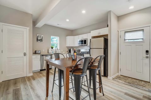 Cozy dining space with seating for four, seamlessly connected to the fully equipped kitchen for effortless meals and gatherings.





