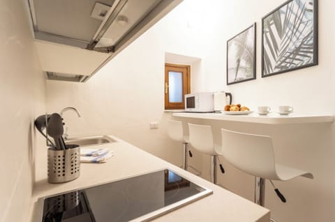 Apartment (1 Bedroom) | Private kitchen | Microwave, espresso maker, electric kettle, highchair