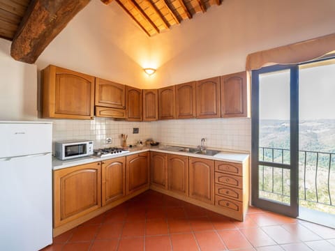 Interior Design, Ceiling, Flooring, Room, Kitchen, Floor, Cabinetry, Wood Stain, Kitchen Appliance, Countertop
