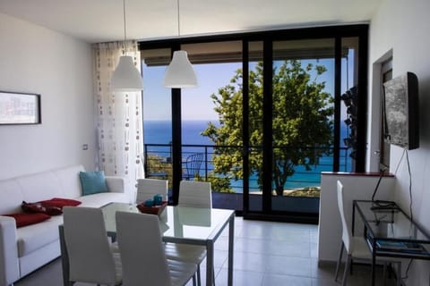 Superior Apartment, Balcony, Sea View | Living area | TV