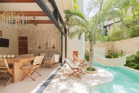 Private pool with hammocks and seating area, directly accessible from your living room.